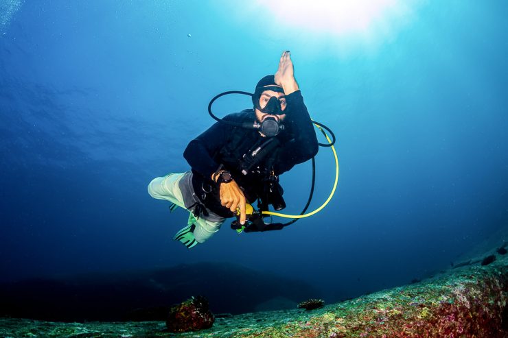 Scuba diver exploring Cabo San Lucas coral reef